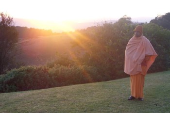 Swami Smarananandaji at sunrise in Drakensburg